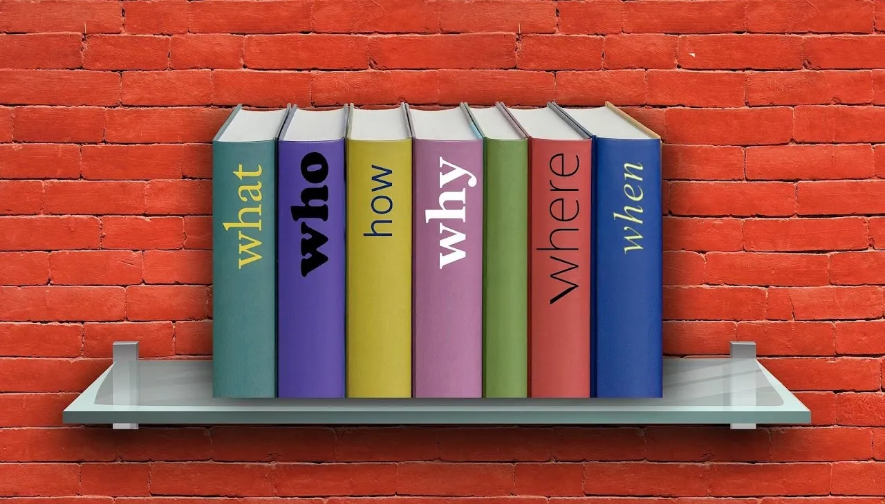 Books on a shelf labeled what, who, how, why, where, when